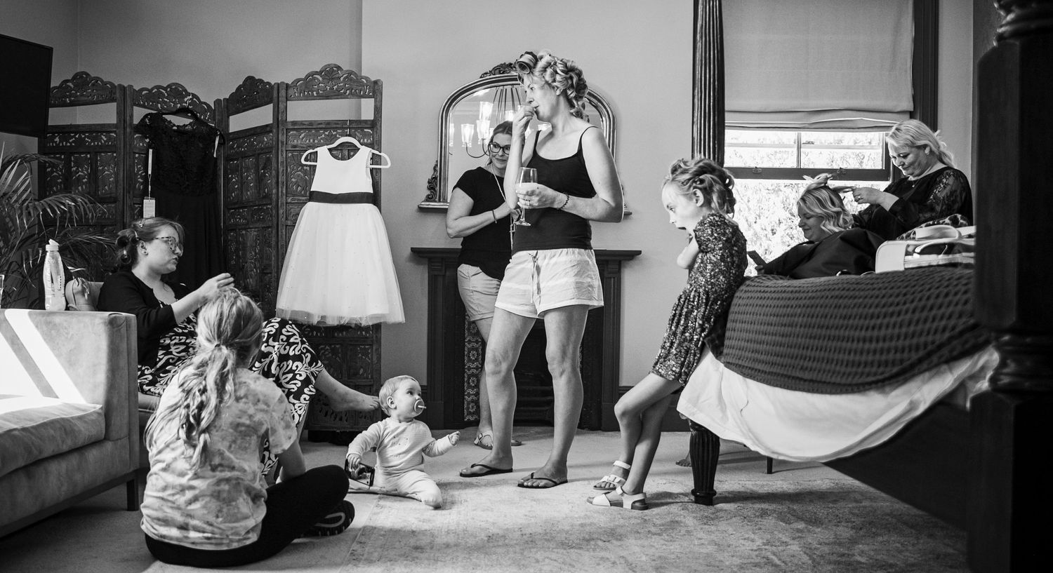 Black and white sequence showing preparation moments before a wedding ceremony.