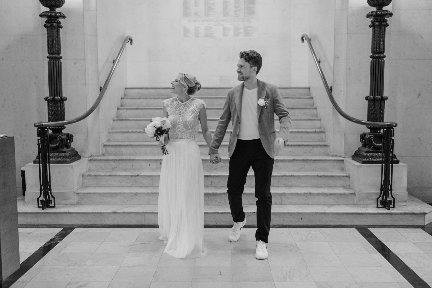 Bride and Groom standing inside the foyer of Marylebone Town Hall Registry office