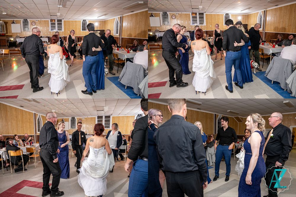 Wedding reception with dancing couples in formal attire in a community hall setting.