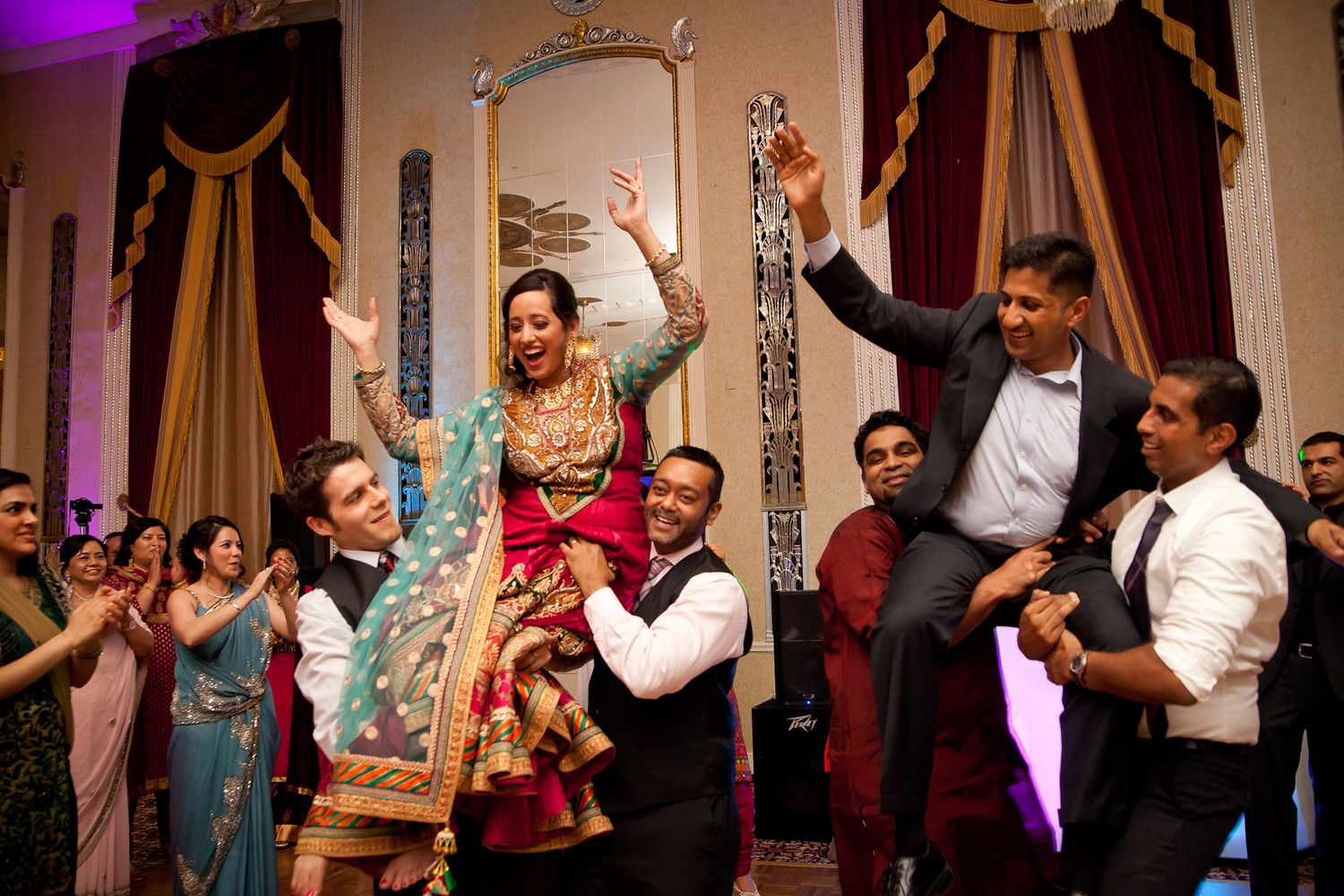 laughing dancing Indian wedding at The Pfister in Milwaukee Wisconsin by Meg Johnson Images