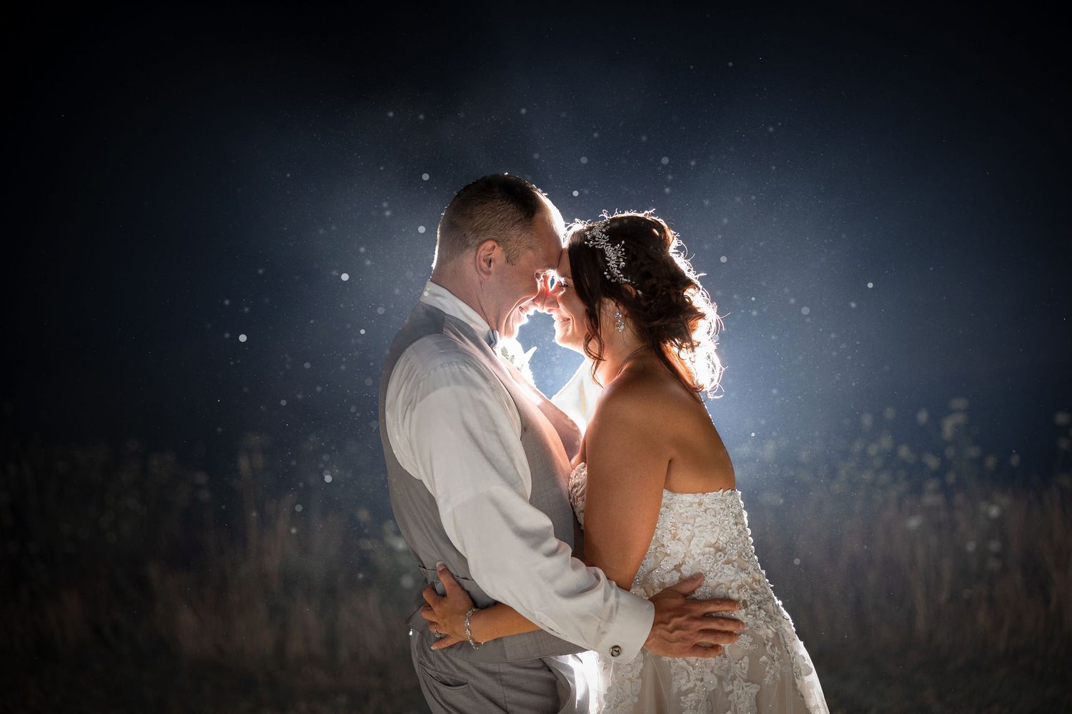 Bride and Groom embracing with glowing light and stars in Milwaukee Wisconsin by Meg Johnson Images