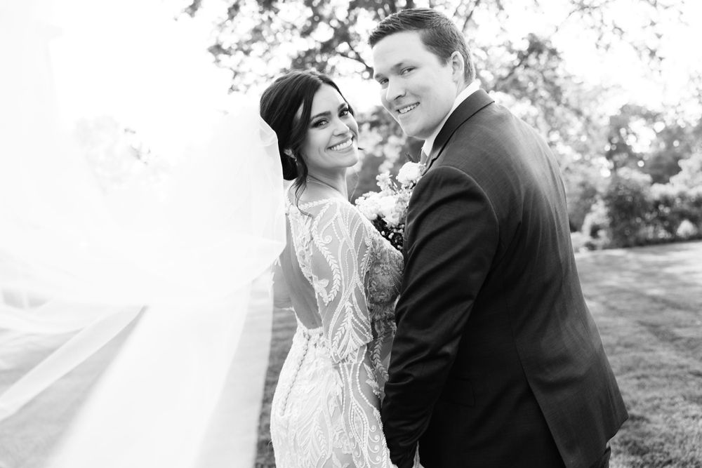 Bride and groom smiling at Jorgensen Farms in Westerville, Ohio.