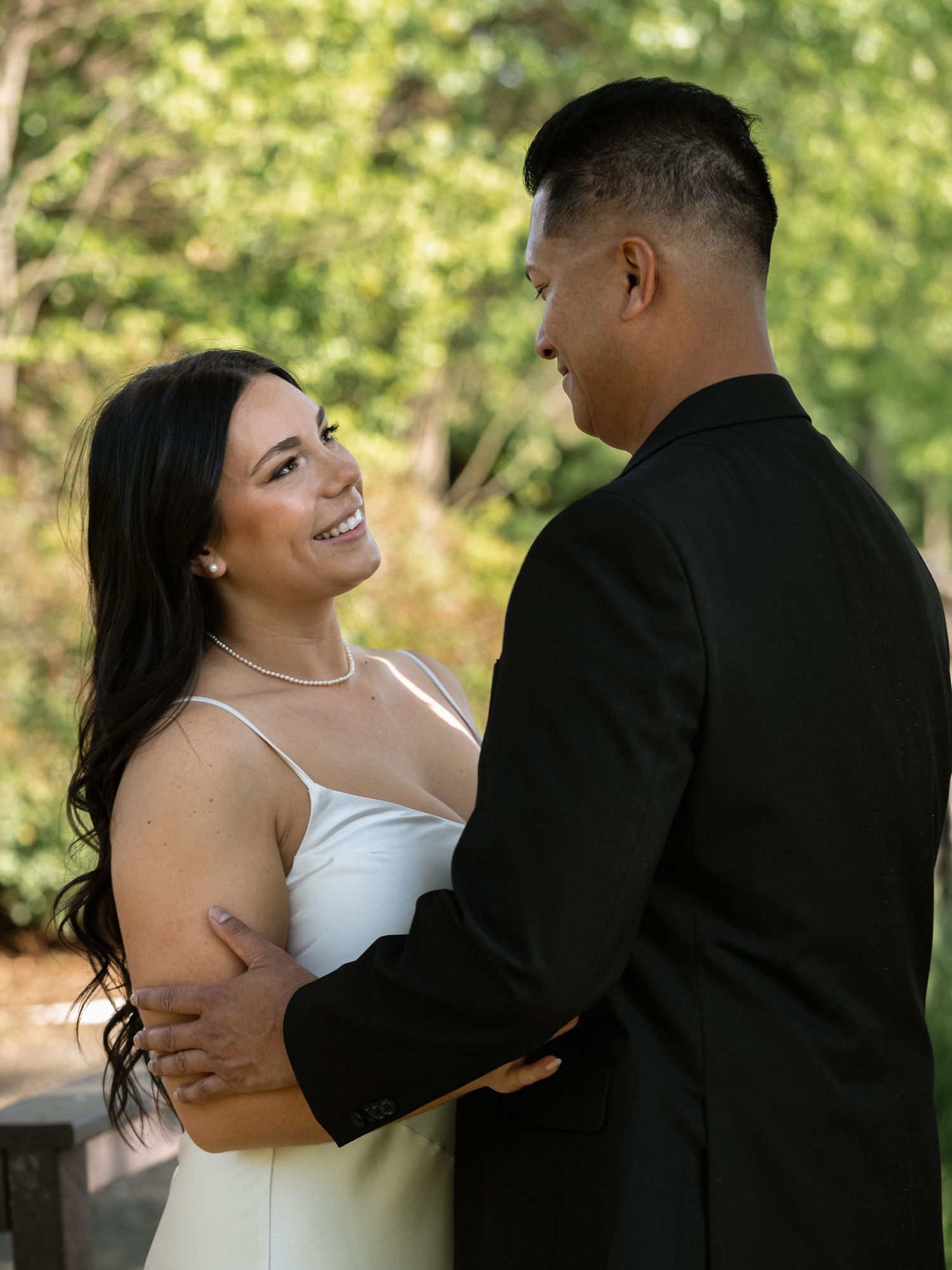 Romantic dance moment captured in natural outdoor lighting.