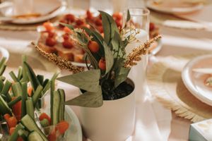 Elegant table setting with floral arrangements and place settings for a special occasion.