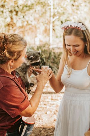 Sweet interaction with a cat during outdoor photography session.
