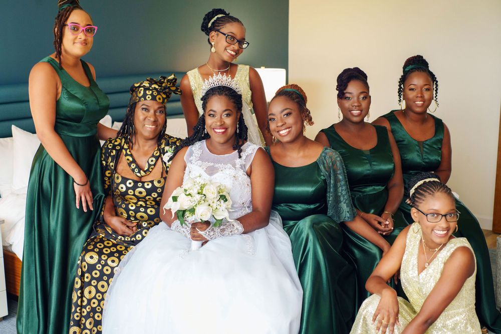 Bride laughing with bridesmaids during wedding morning preparations.
Trinidad wedding photographer