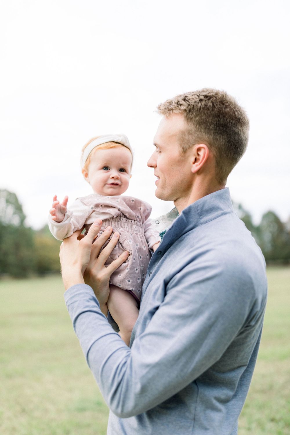 Sweet family moment captured in outdoor portrait series.