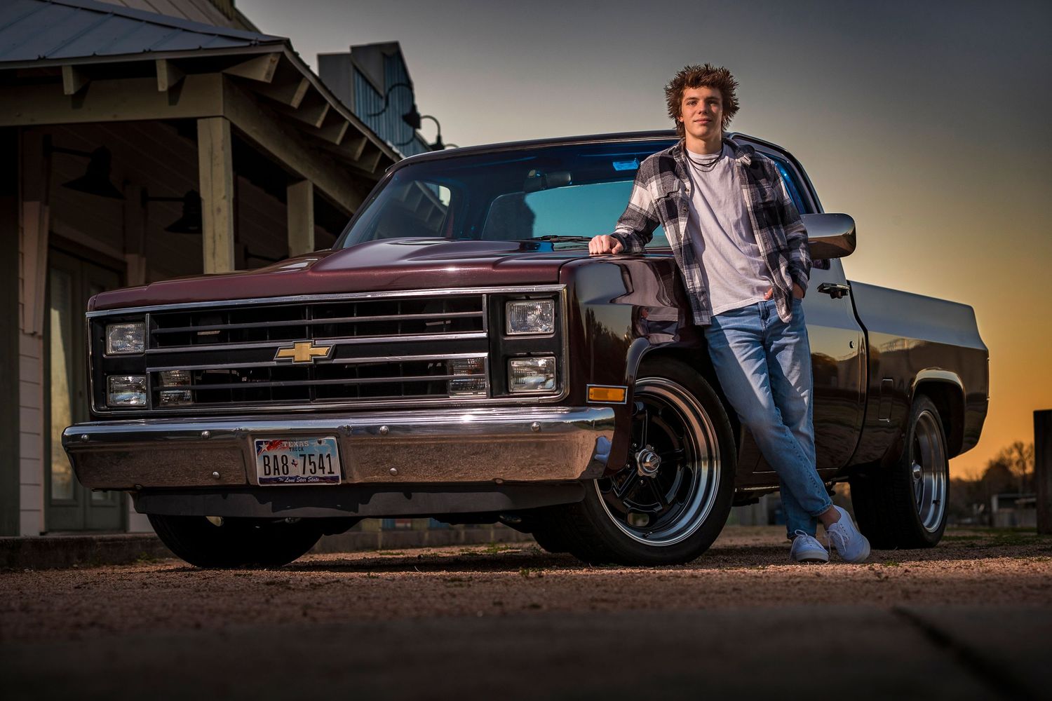 Classic Chevrolet pickup truck photographed at sunset with dramatic lighting and vintage styling.