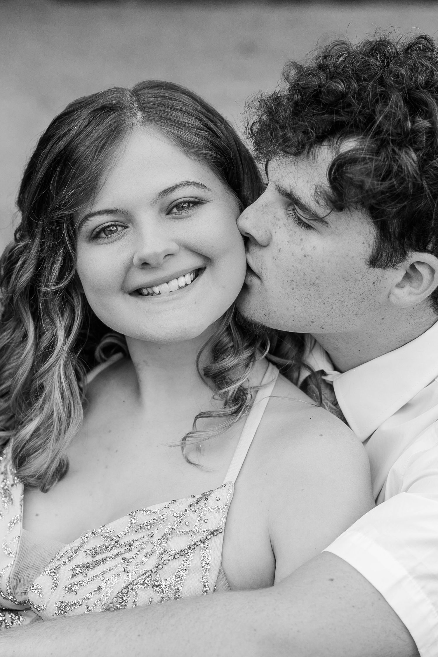 Black and white close-up series capturing intimate romantic moments between a couple.