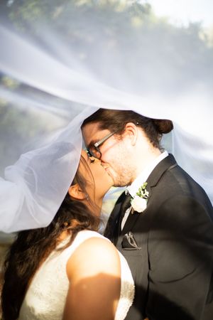 bride and groom kissing under their veil in Kemp Place at Moonta Bay