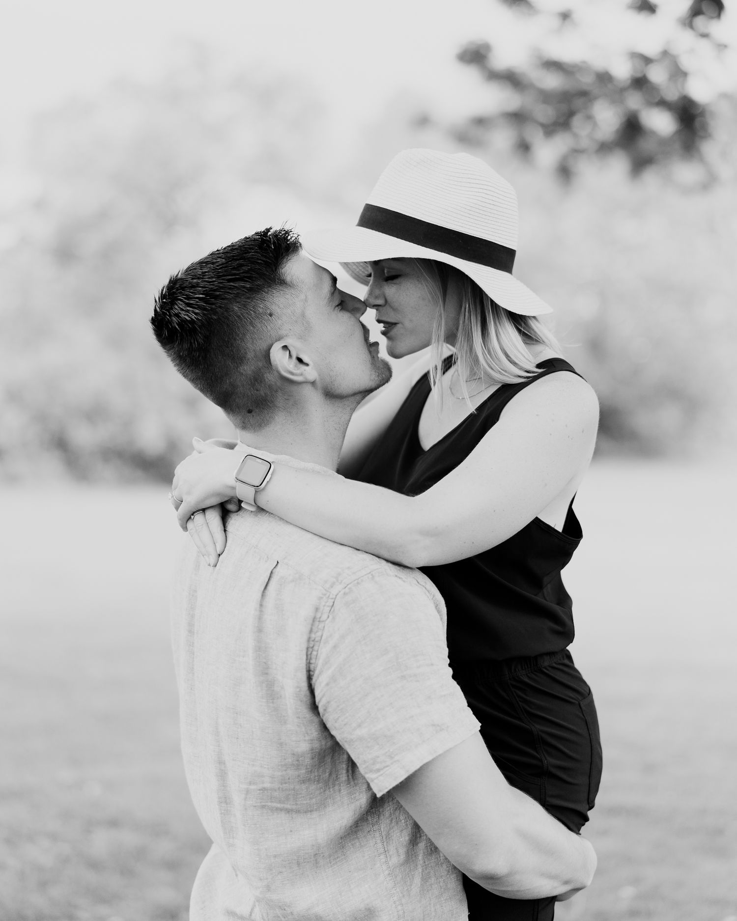 An intimate engagement photo of a couple in black and white. Classic and film-inspired wedding photography in Madison, Wisconsin.