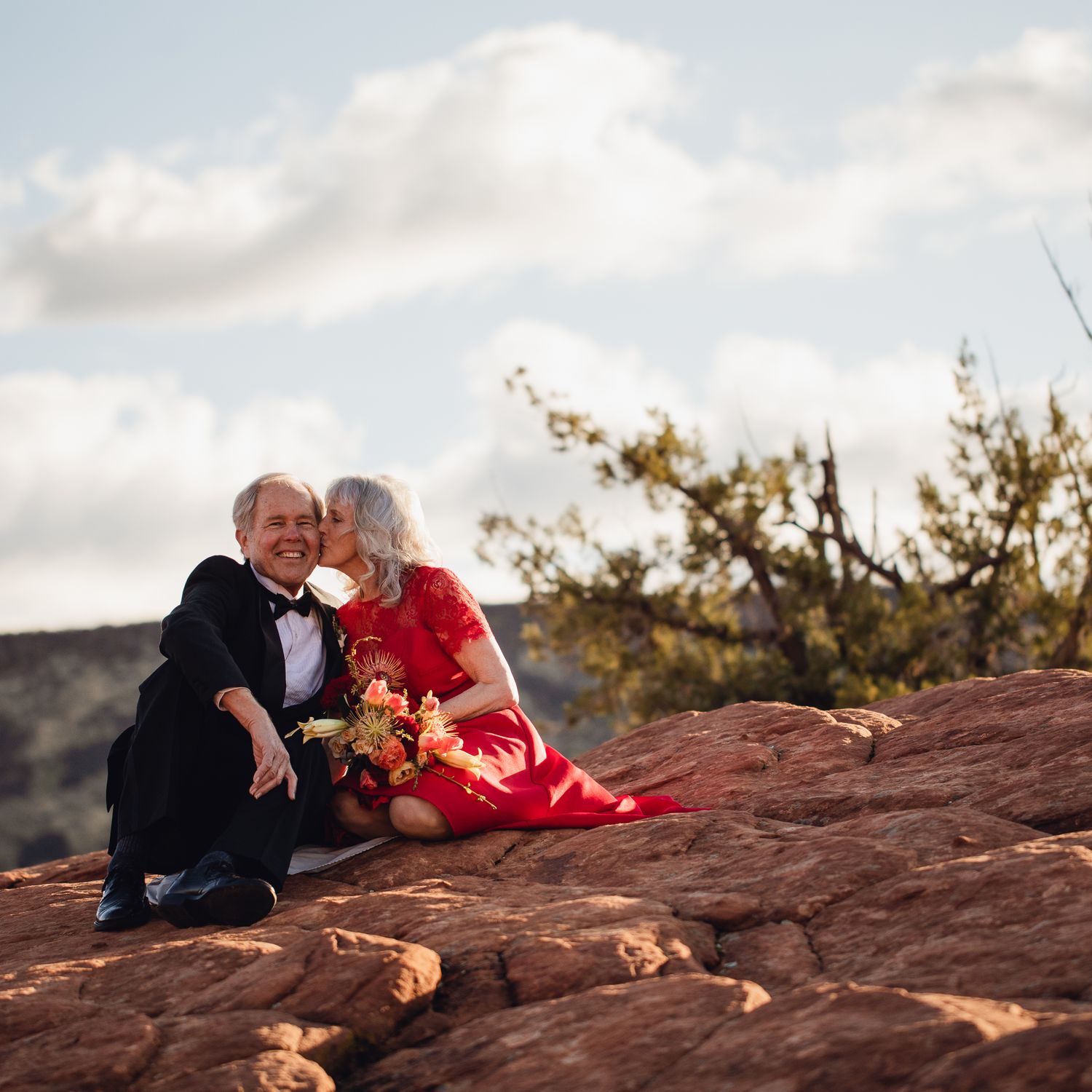 Older couple renewing their vows in the desert.