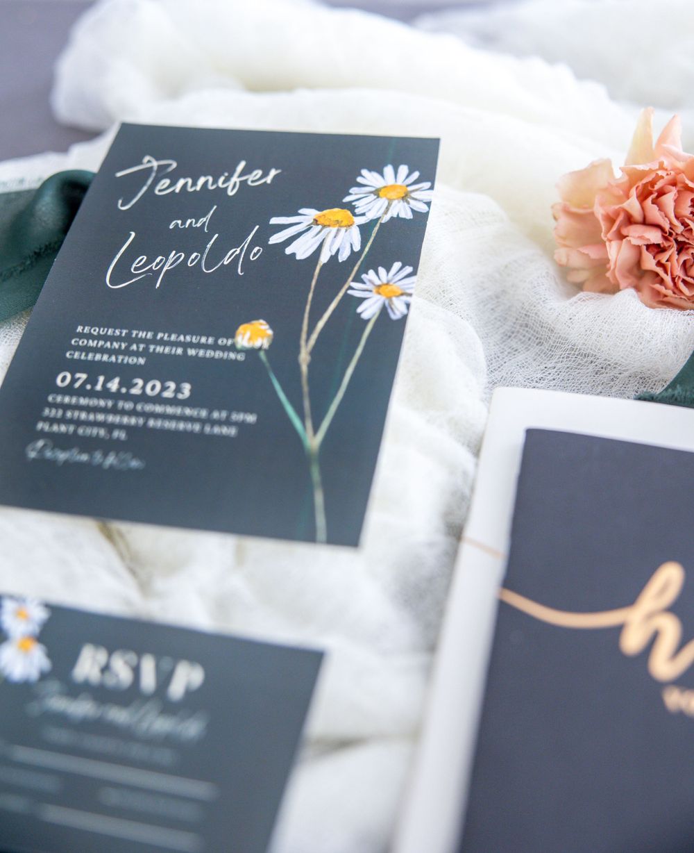 Wedding invitation detail shot with elegant design, showcasing delicate textures and accents in soft colors.