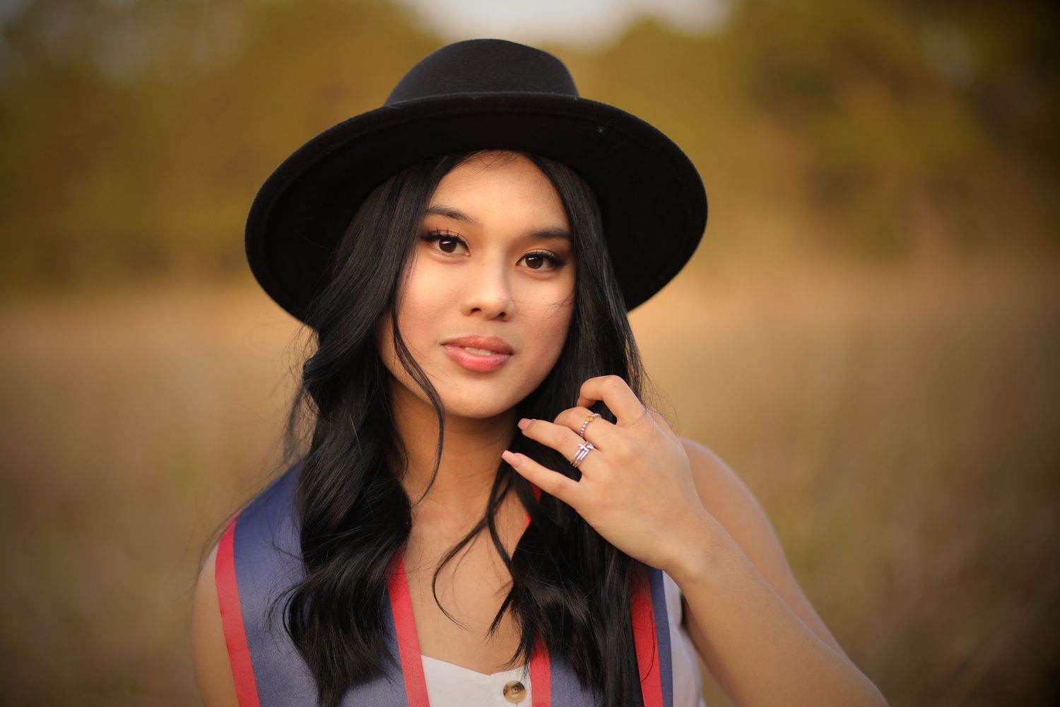 Modern Senior wearing black hat. Graduation portrait by Larsen Video Marketing and Event Capture