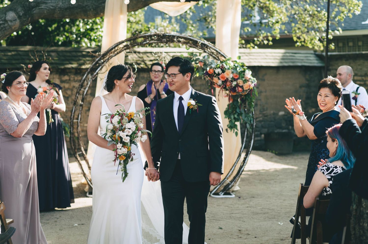 bride and groom exiting the ceremony as husband and wife in Monterey