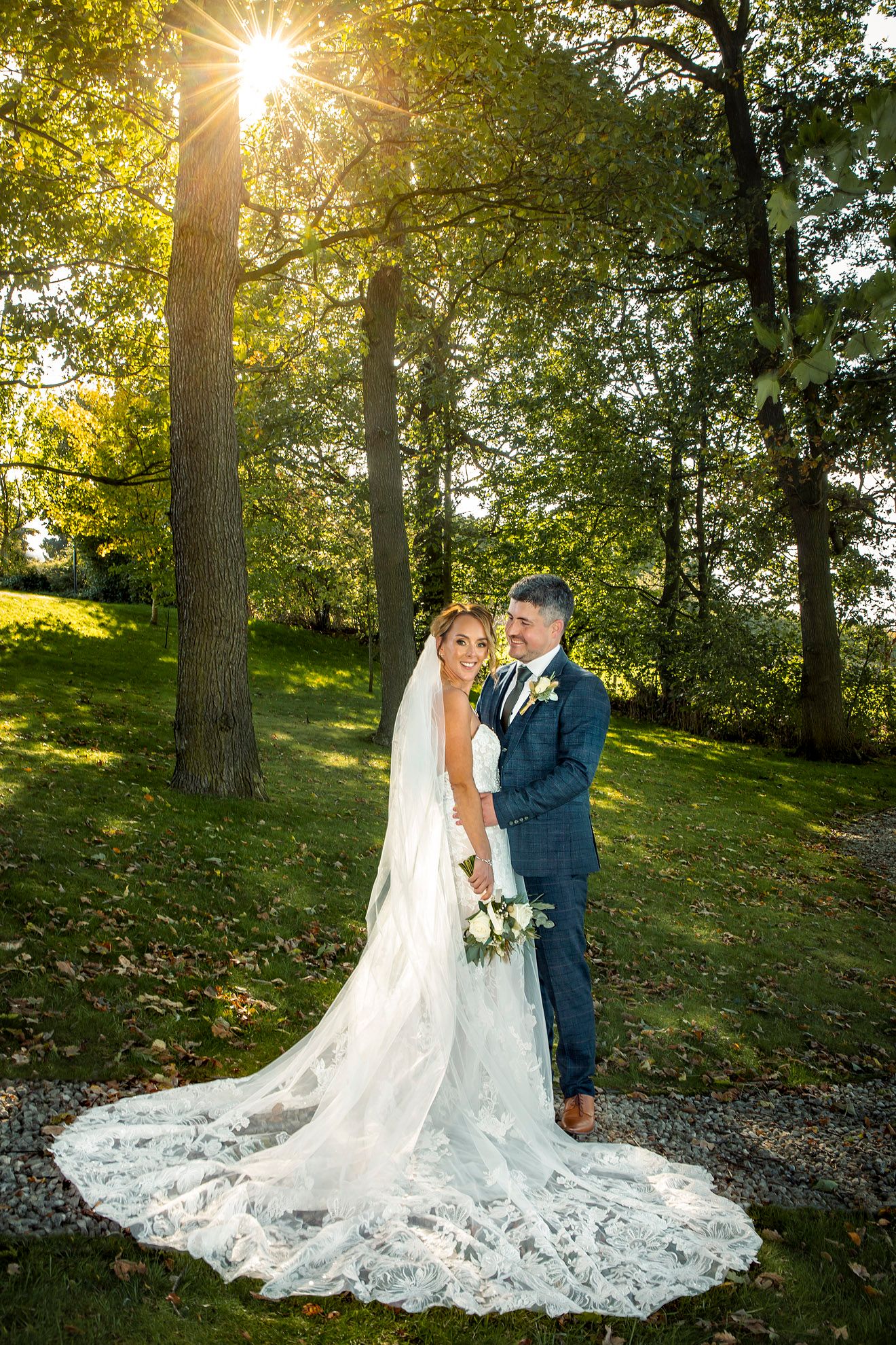 wedding photographer at 315 bar and restaurant under the trees with sunlight