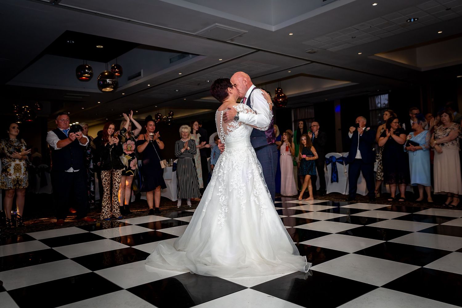 Bride and groom finish the first dance at the Crowne Plaza Hotel. Liverpool city centre wedding photographer