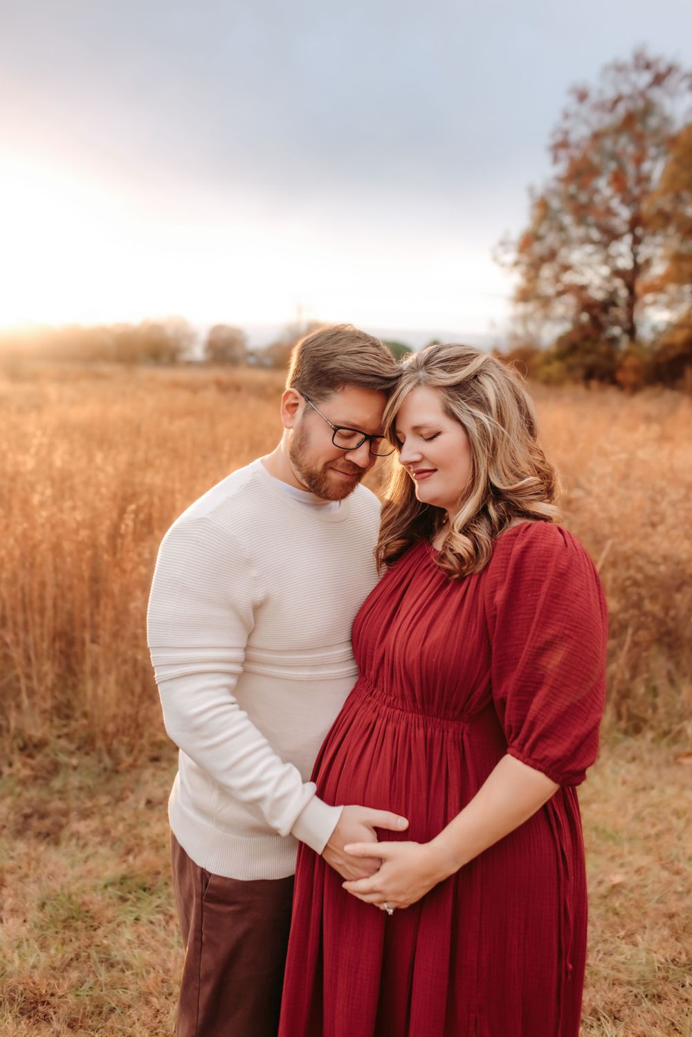 Parents-to-be holding hands during maternity session in Hickory NC