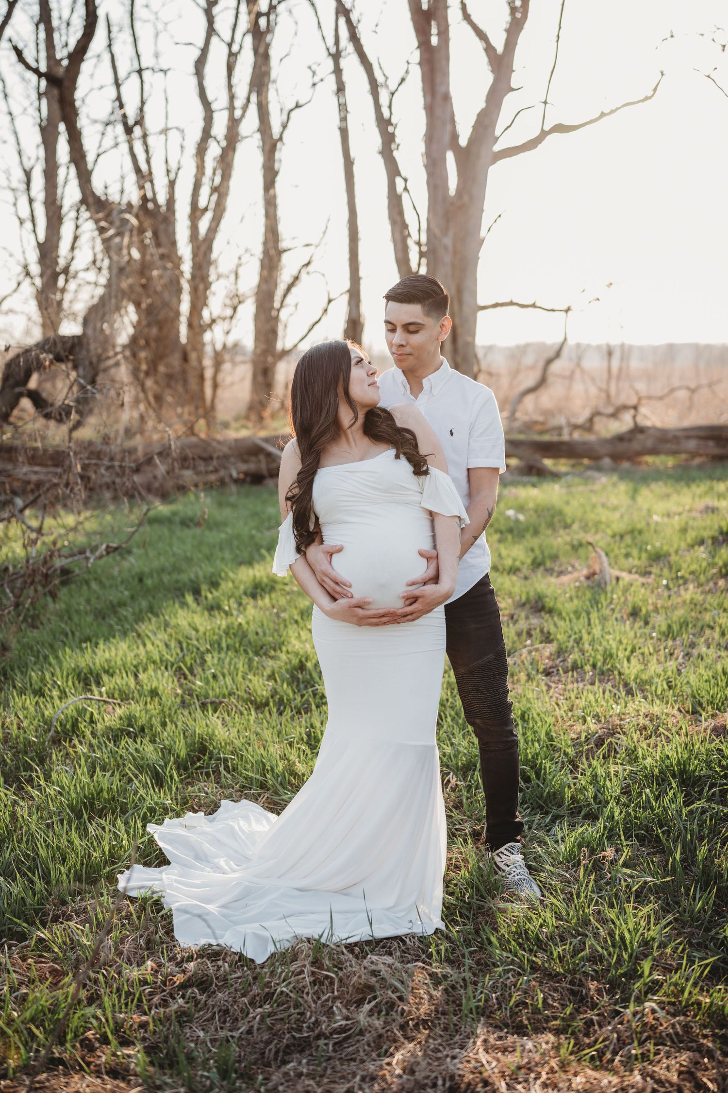 family photo, white maternity gown, in a field