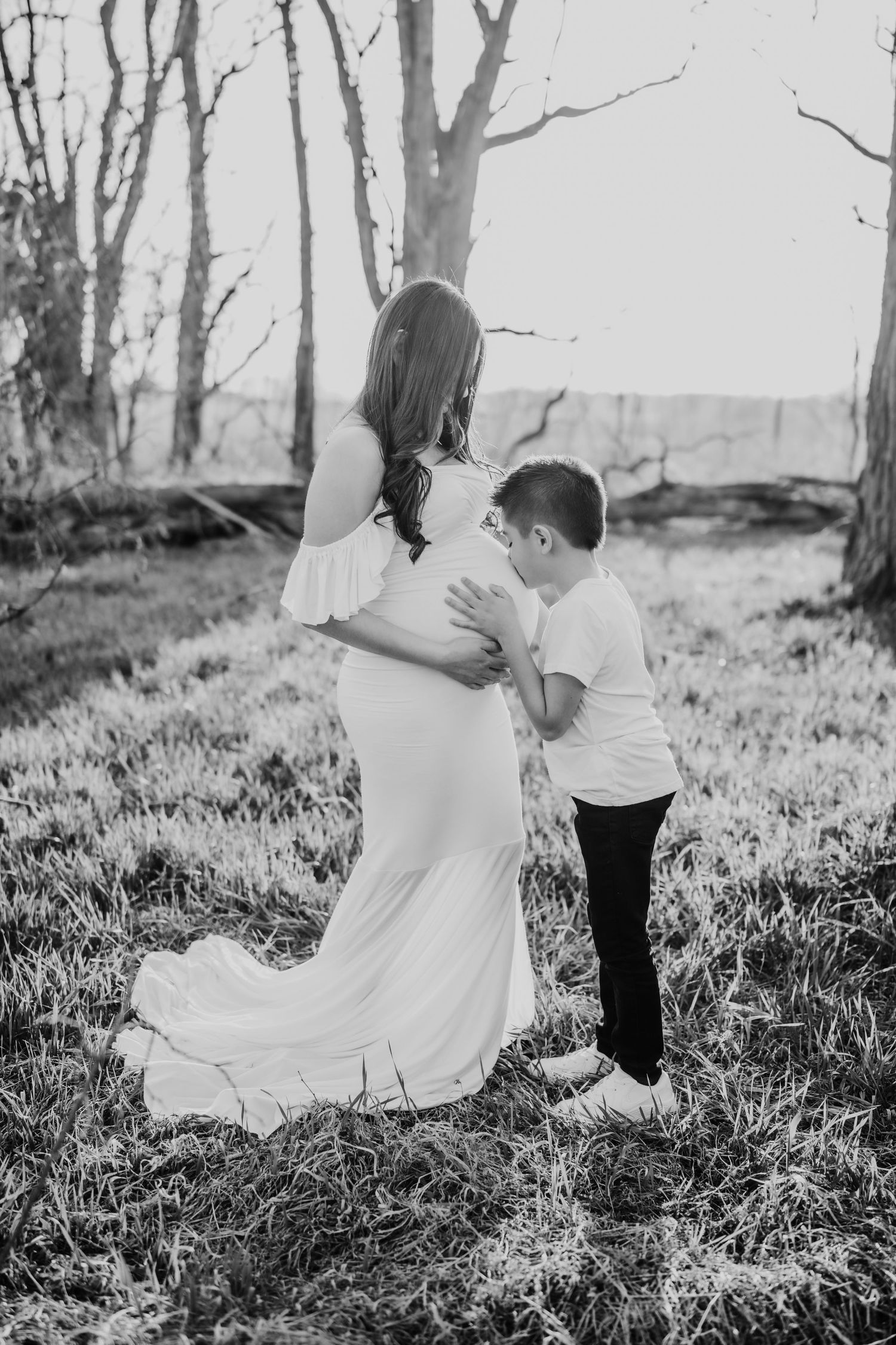 family photo, white maternity gown, in a field