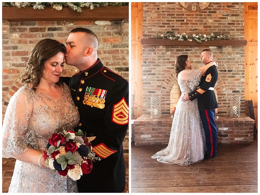 Marine Corps Gunnery Sergeant groom embraces bride in lace gown at rustic barn wedding venue.