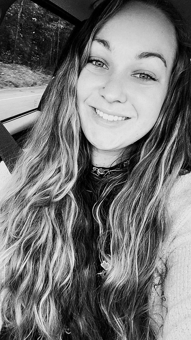 smiling photographer black and white