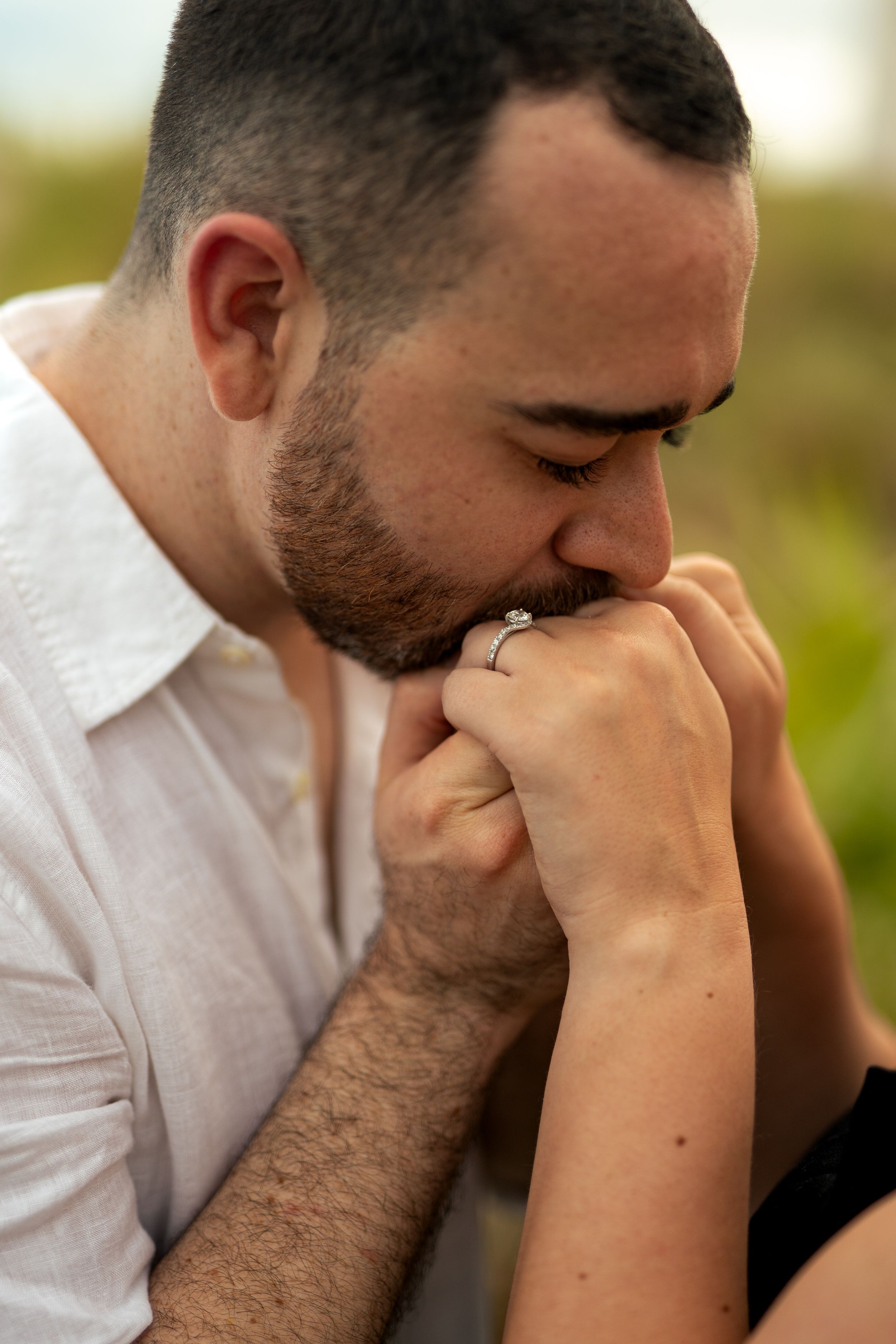Close-up profile shots of someone wearing a white shirt and displaying emotional expressions.