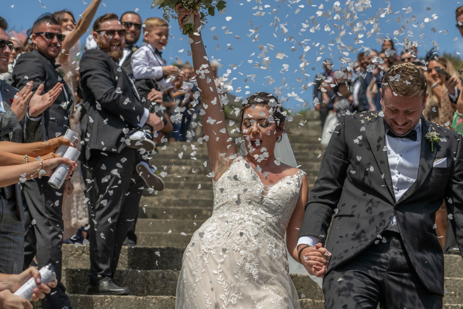 Wedding Bride in a shower of confetti - Gavin Horrell Photography, South West England