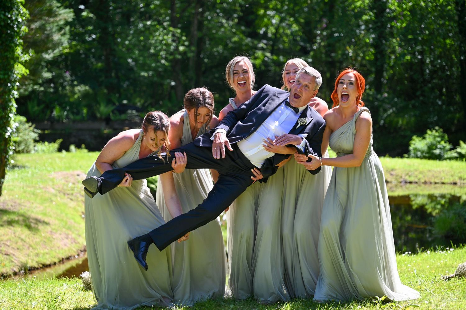 Father of the Bride being hoisted by the bridesmaids - gavinhorrellphotography.com