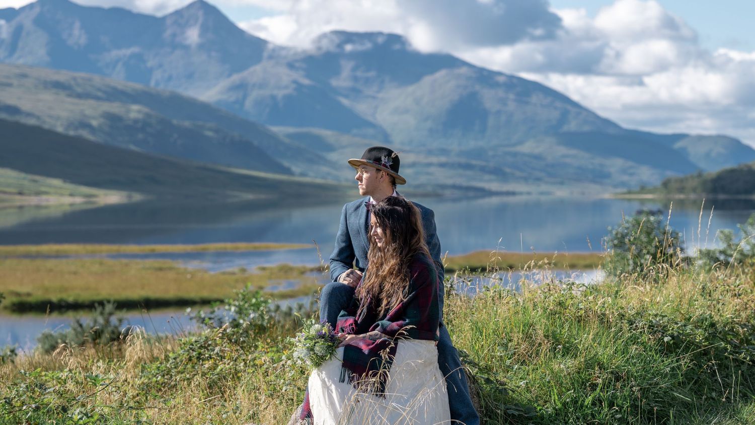 Bride and Groom seated beside beautiful Loch Etive, near Glencoe - Gavin Horrell Photography
