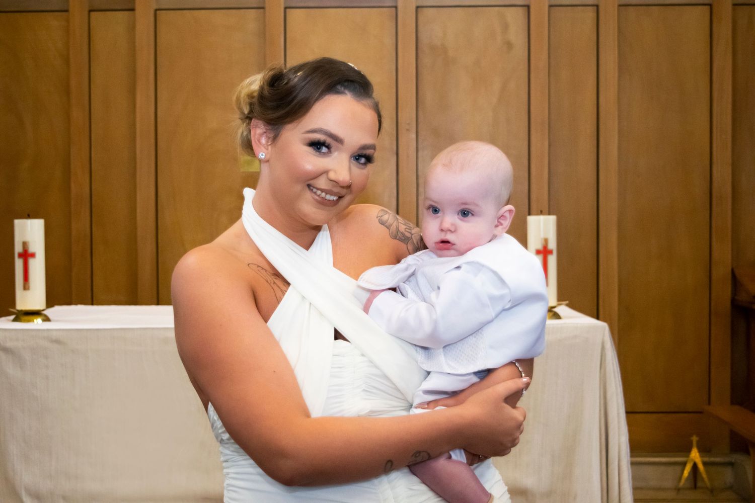 baby boy and beautiful mother at church in stainforth doncaster for christening taken by heather katie photography
