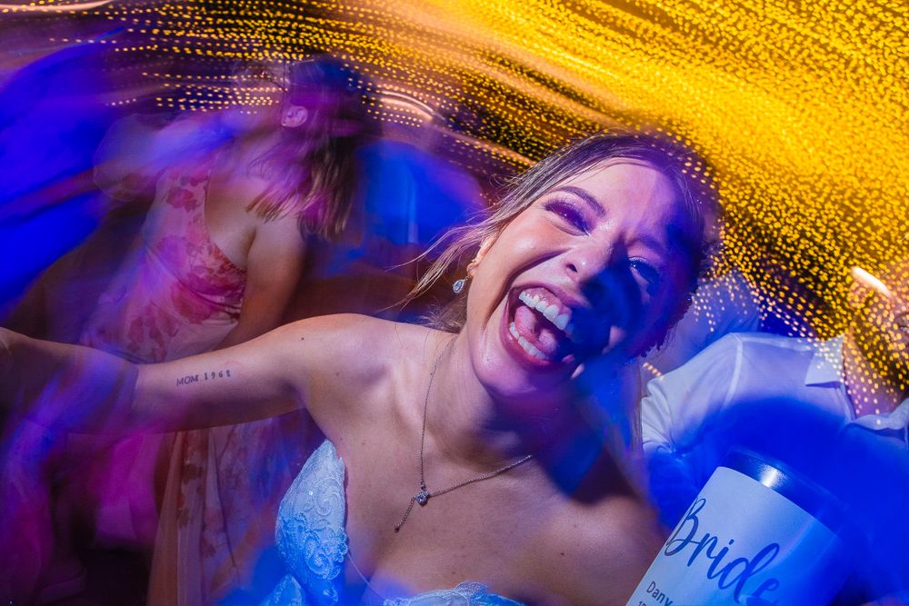 Joyful celebratory moment captured with motion blur and colorful light trails.