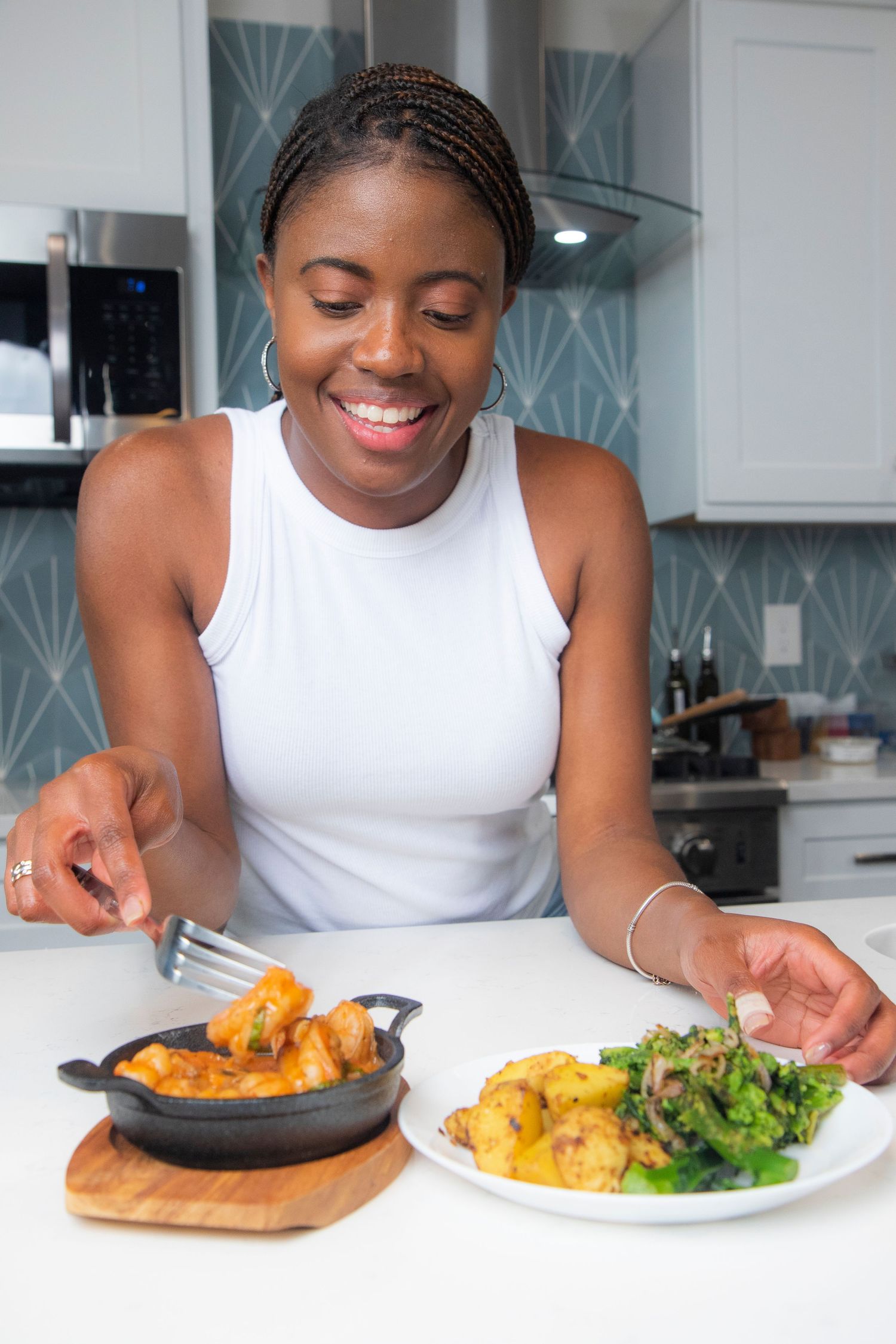 Joyful moment in kitchen with healthy meal on white plate.