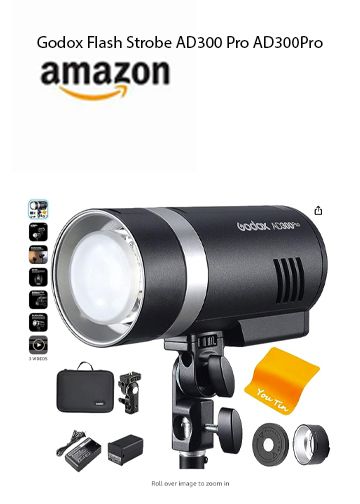 Godox AD300 Pro strobe flash photography light with accessories on white background.