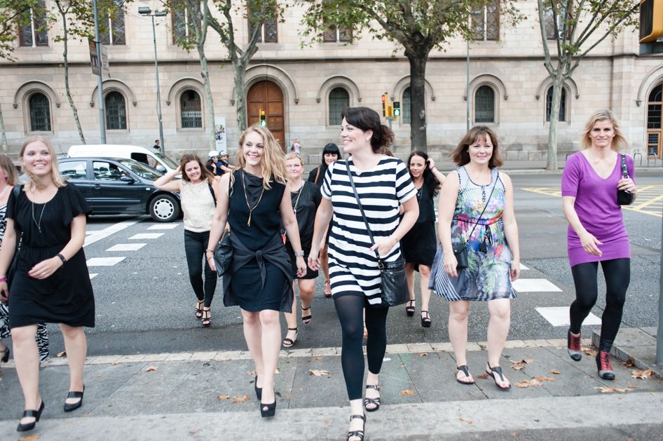 A group of girls cross the road on a holiday photoshoot in Barcelona