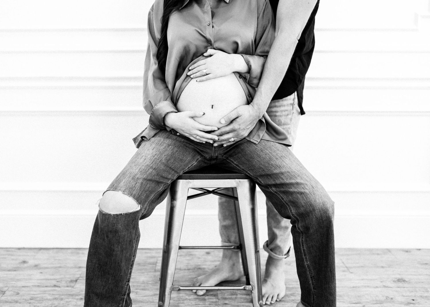 Intimate black and white portrait series showing tender moments between two people.