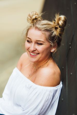 senior girl with two top knots laughing