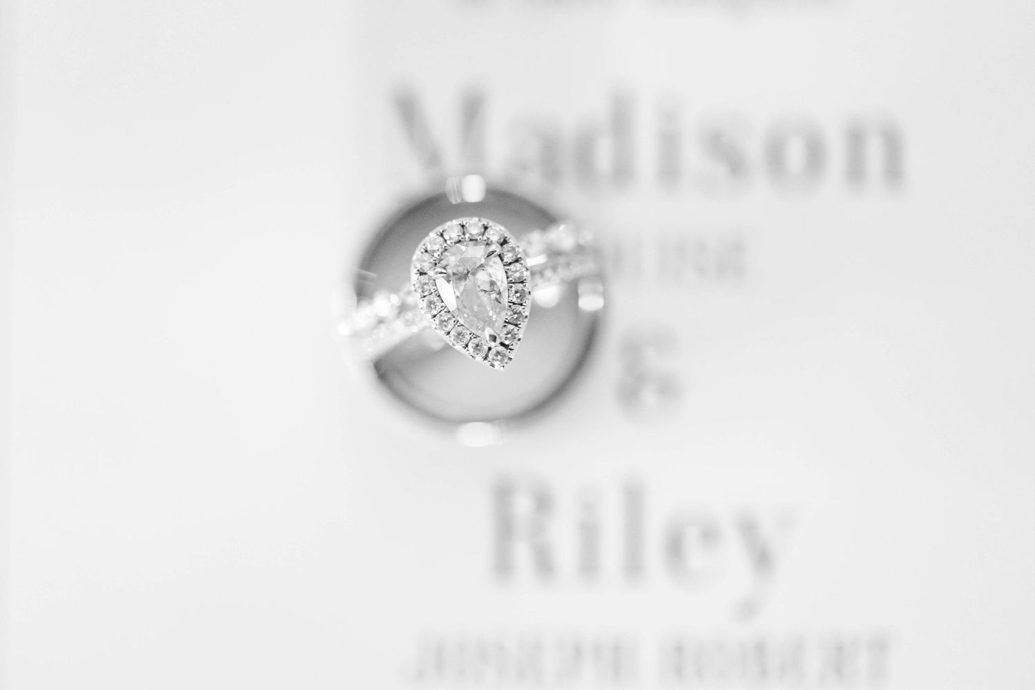 wedding ring with invitation black and white macro shot