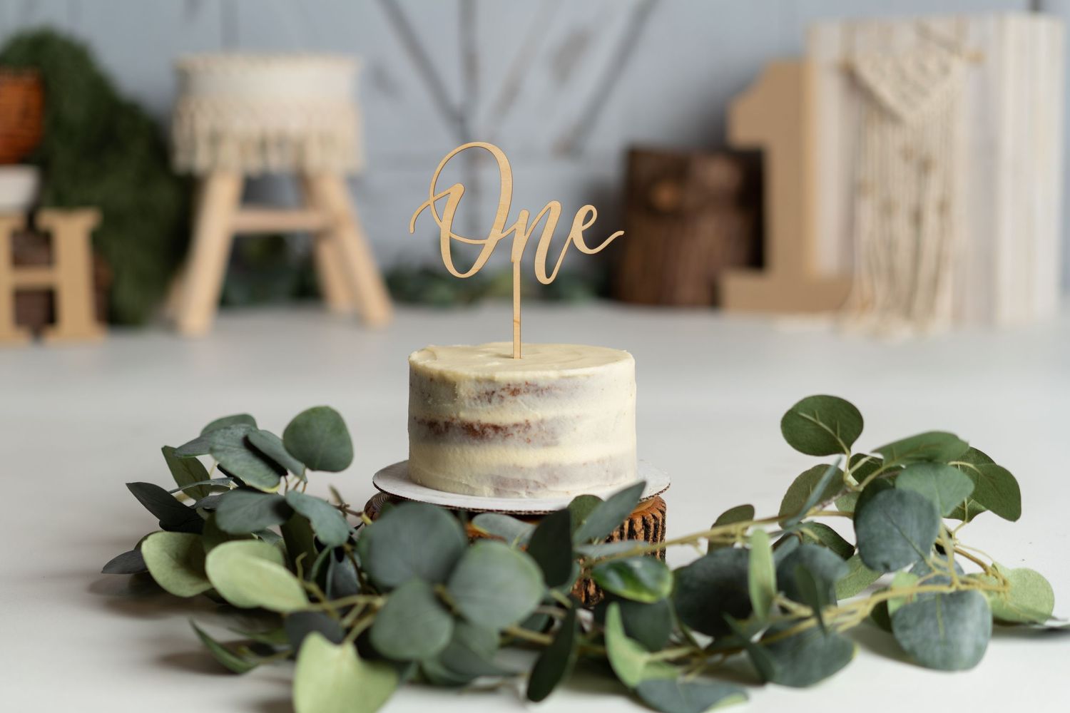 Simple and rustic 1st birthday cake smash session in a Bothell studio. Fun, authentic birthday photography by Filling the Frame Photography