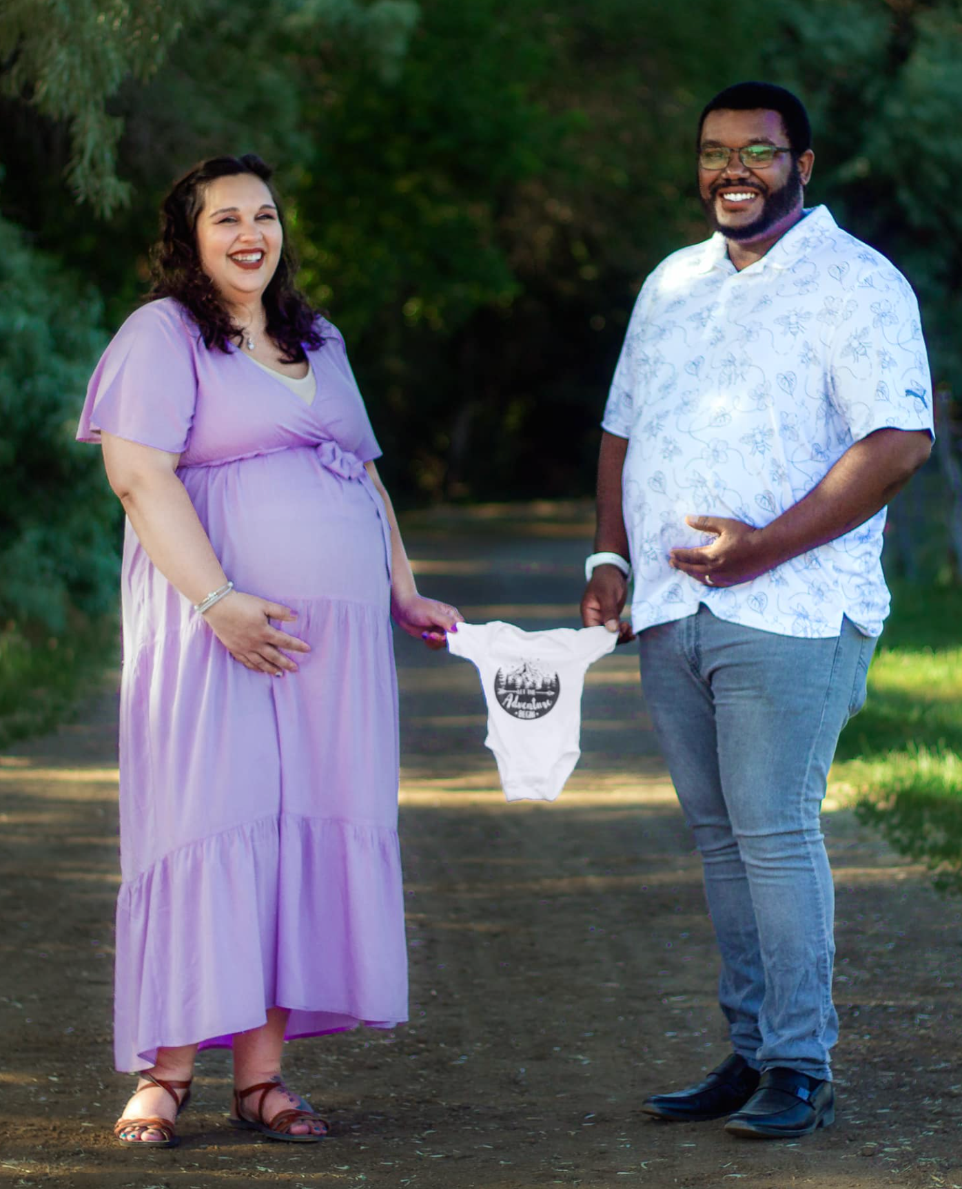 Husband and Wife posing for a maternity photoshoot at Wheeler Farm, Murray Ut.