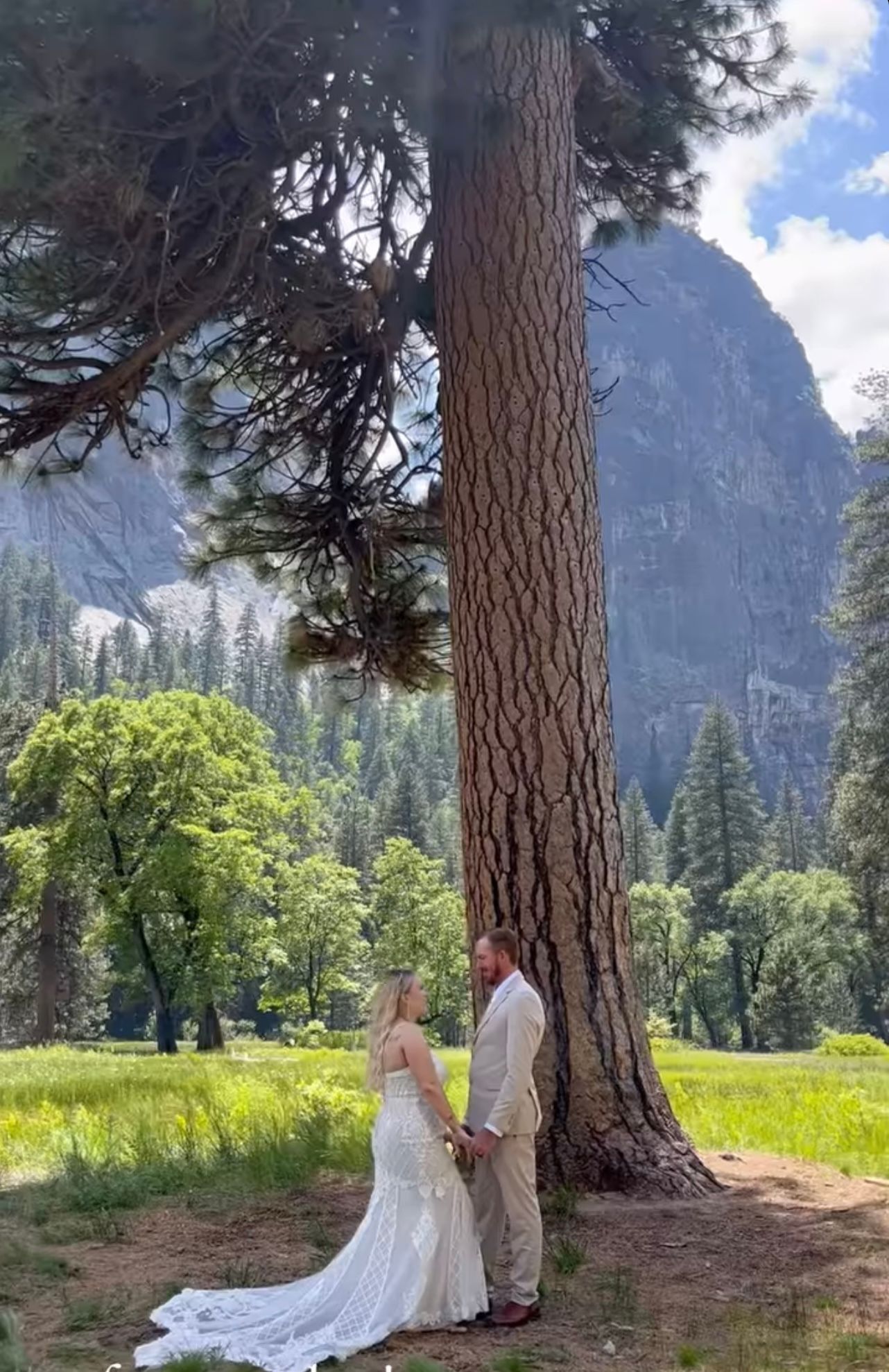 Scenic Yosemite wedding with majestic mountains in the background and a lovely couple exchanging vows