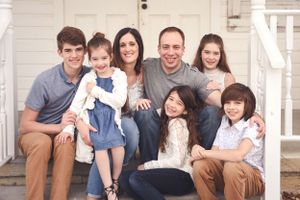 happy family smiling for family photos