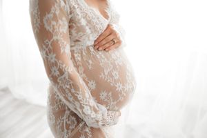 pregnant woman wearing white lace