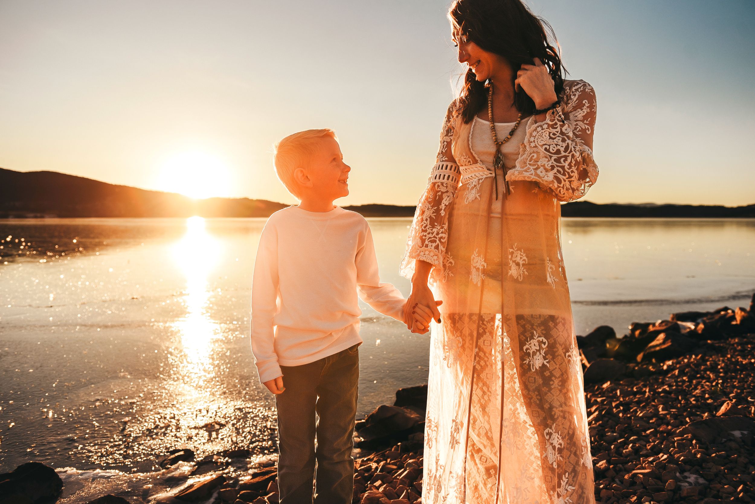 mom and son smiling at sunset in montana