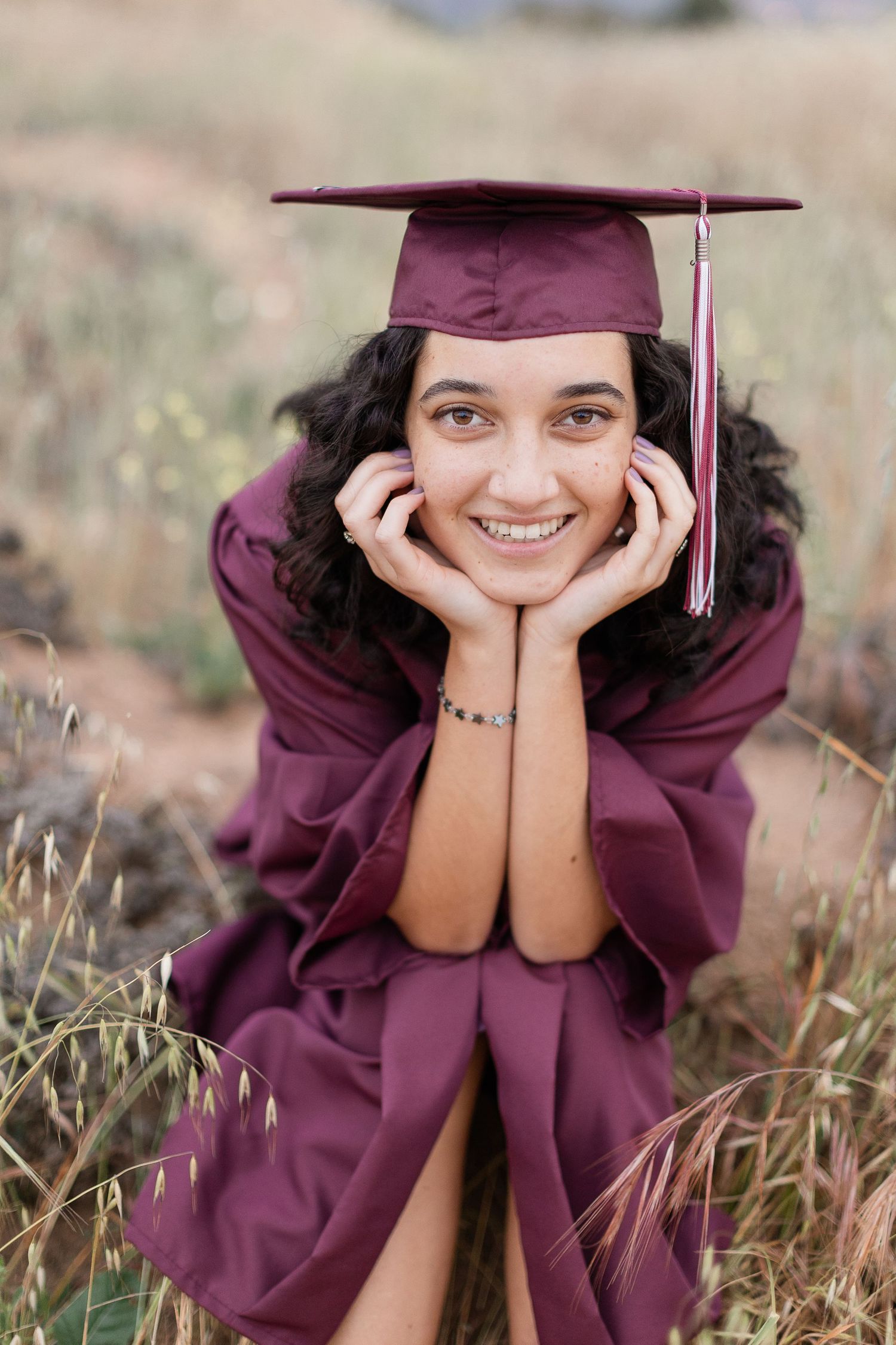 high school senior girl cap and gown pose