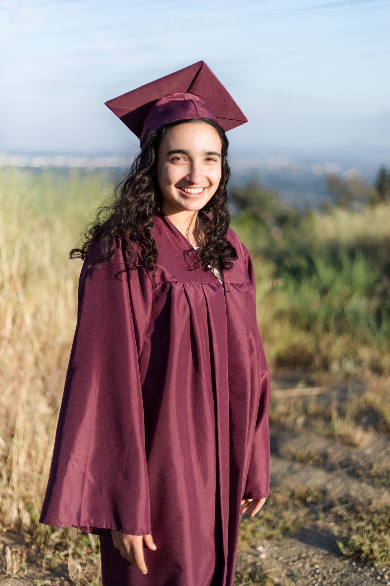 Graduation cap and gown pose