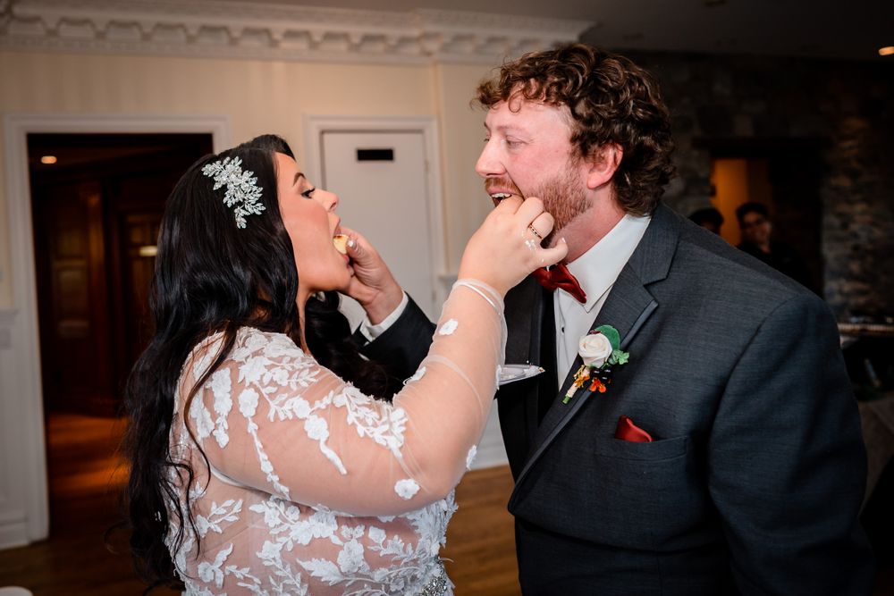 Intimate wedding moment captured during dinner reception with elegant table settings and decor.