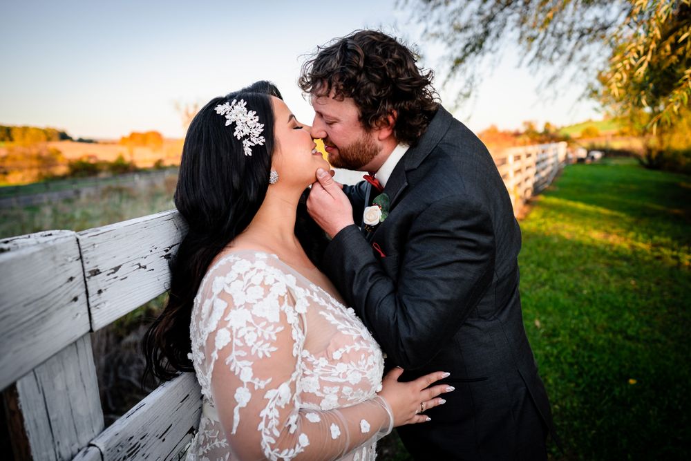 Golden hour wedding photography with couple sharing intimate moment outdoors.