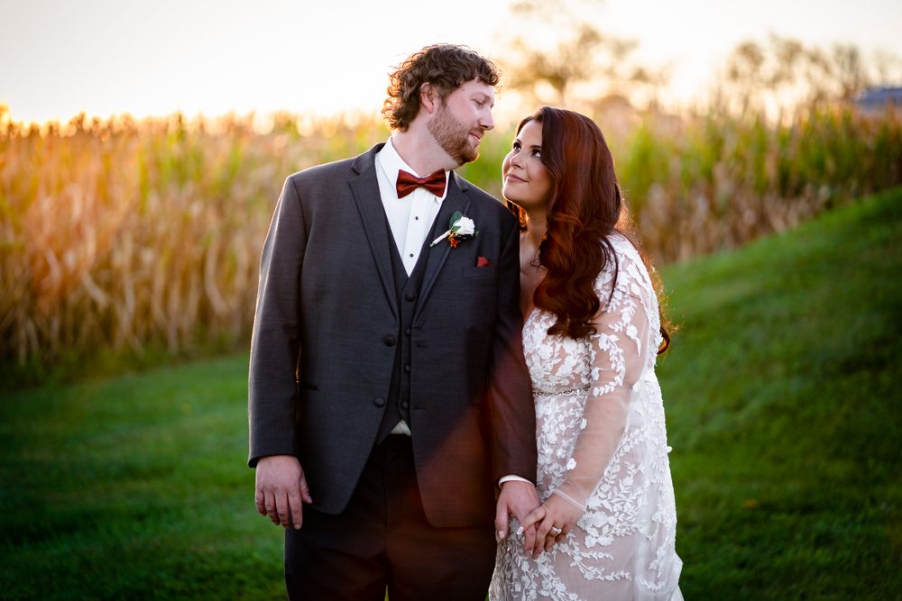 Sunset wedding portraits with couple sharing romantic moments against golden light.