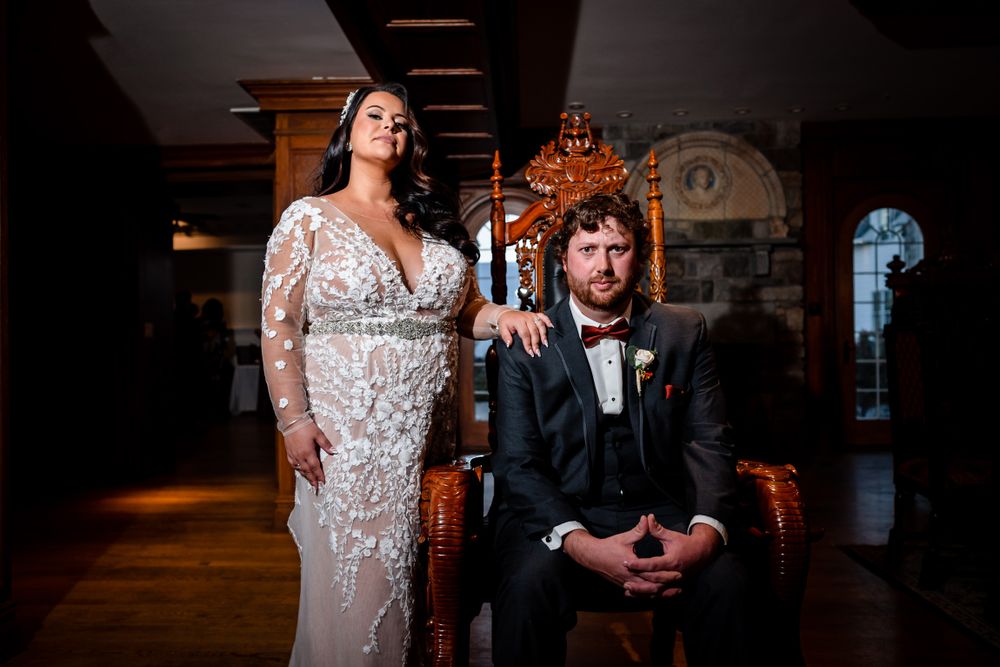 Dramatic indoor wedding reception photos with elegant lighting and vintage decor.